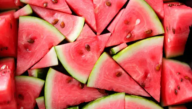 Watermelon seeds and rind separated to show what dogs should avoid.